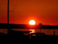 Sunset Over Lake Charlevoix From Marina In Boyne City, MI