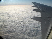 Looking Down On Clouds From Airplane